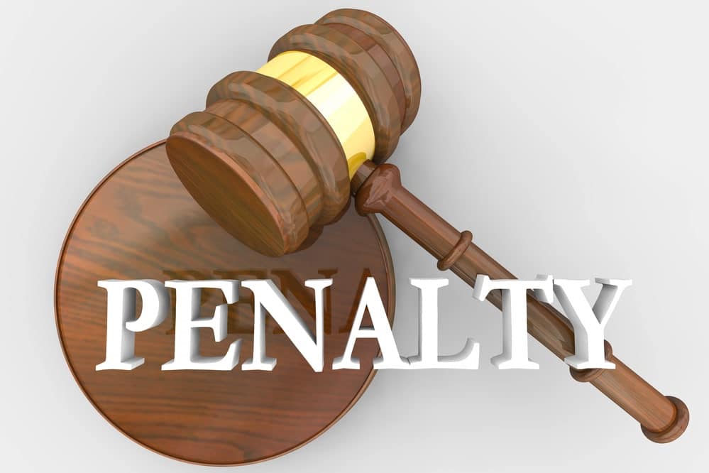 Wooden gavel and penalty text symbolizing legal consequences for underage drinking